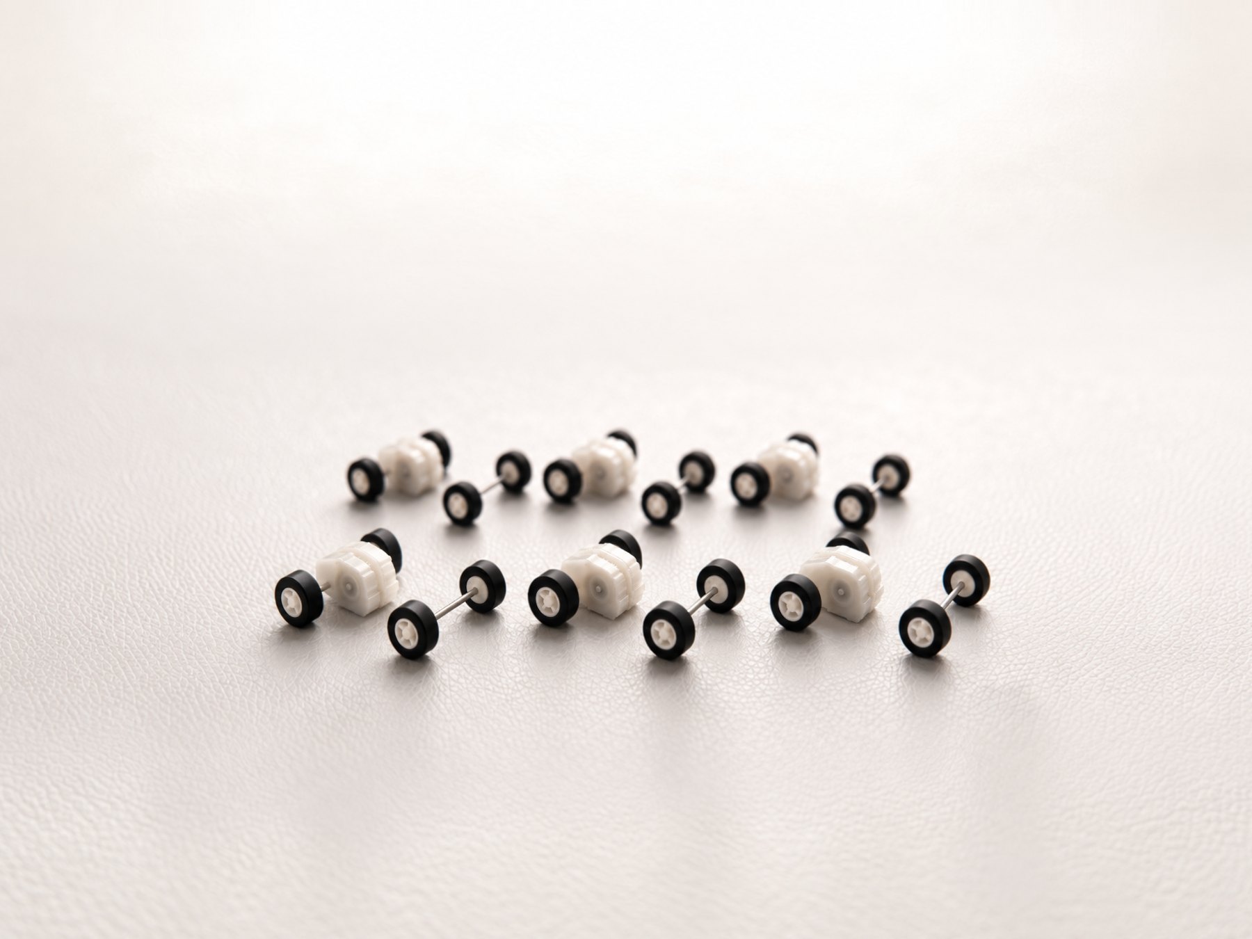 Six Ant pull-back motors, each with its matching 11 mm front wheel-and-axle set