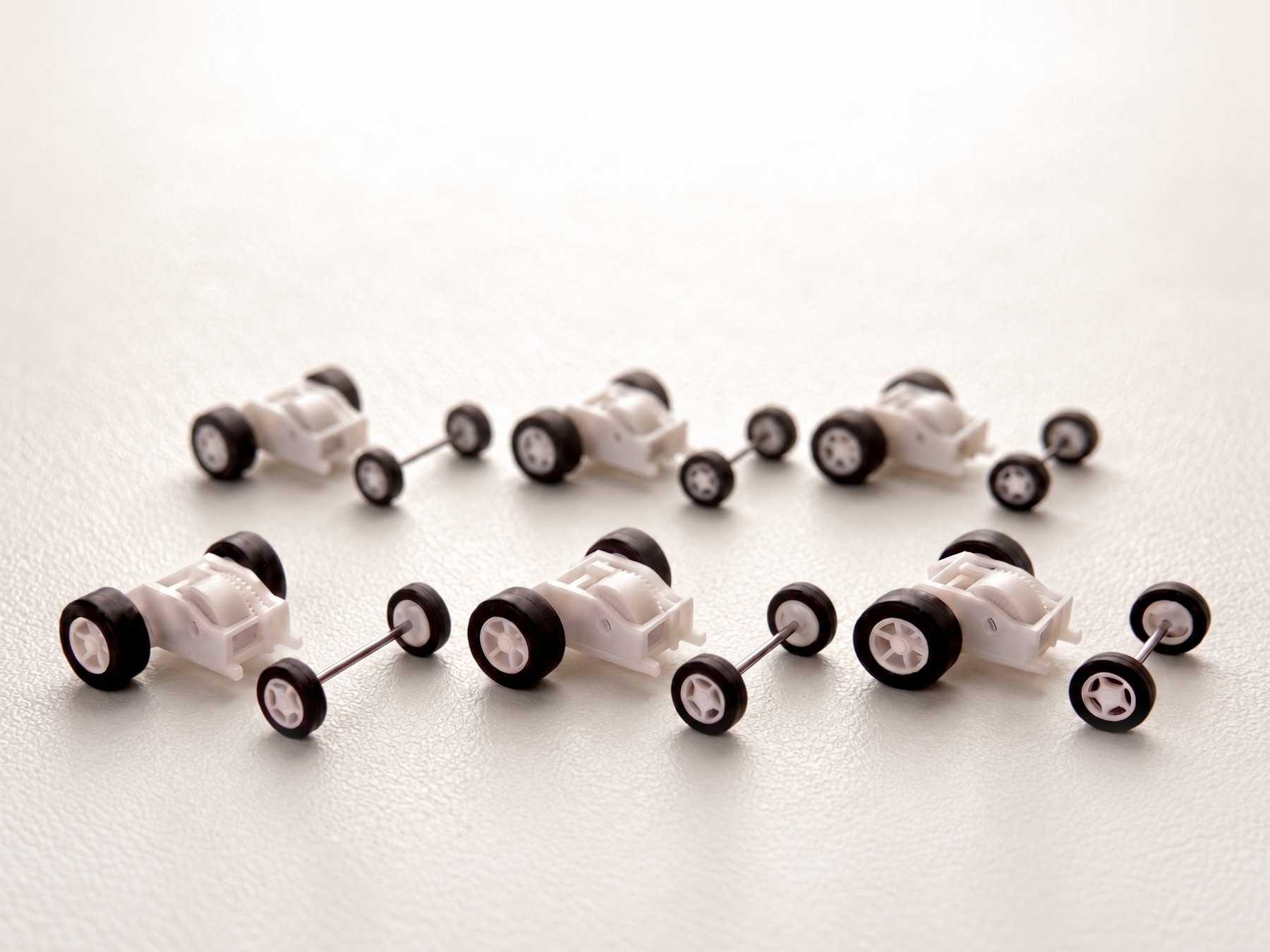 Six Brute pull-back motors, each with its matching 16 mm front wheel-and-axle set