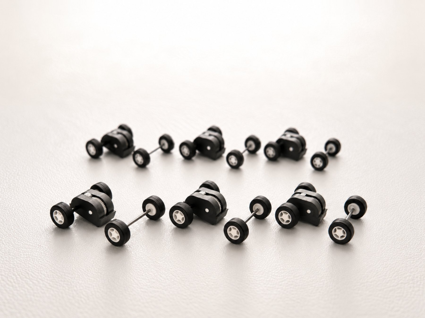 Six Stout pull-back motors, each with its matching 16 mm front wheel-and-axle set